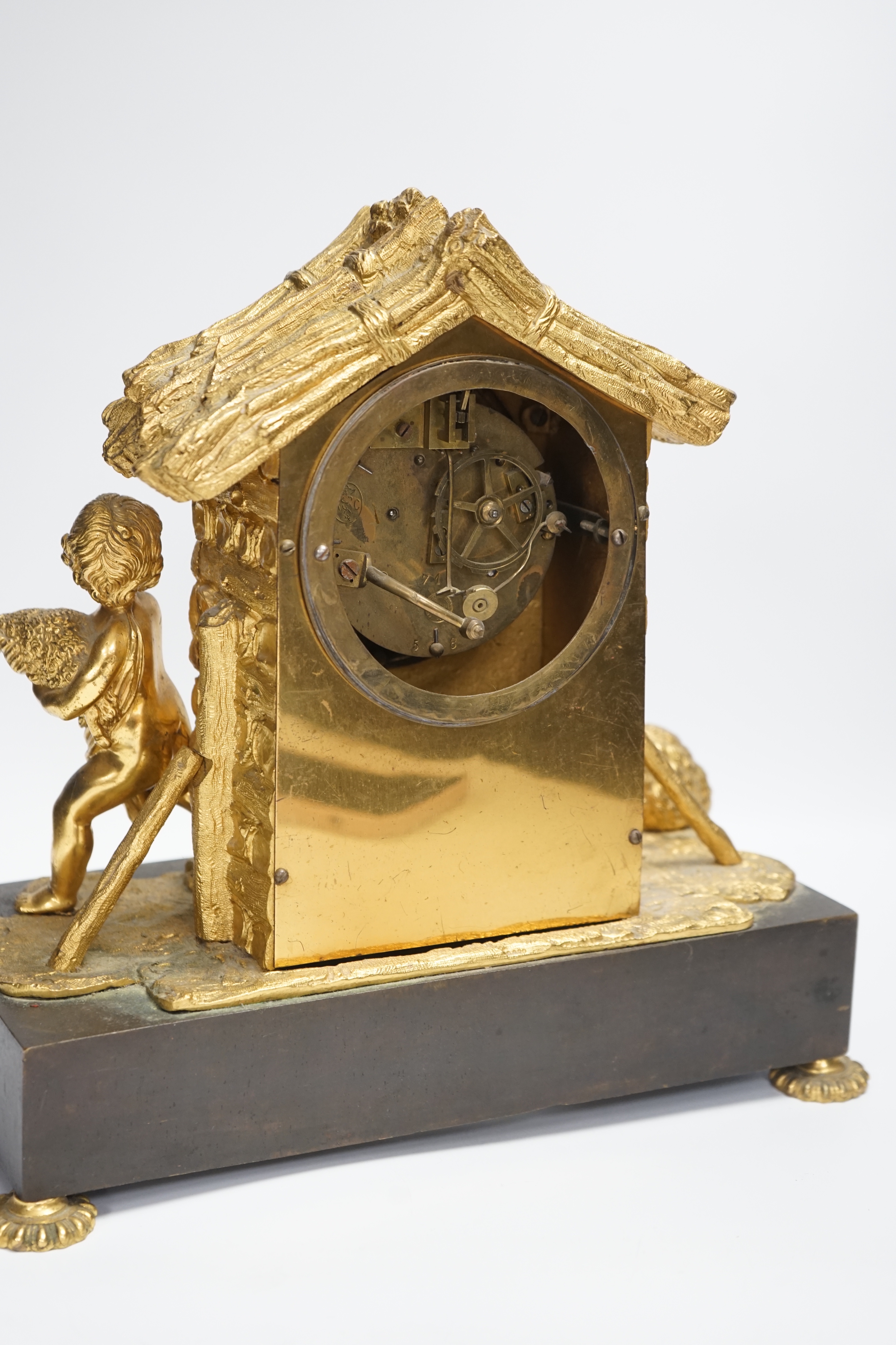 A 19th century ormolu clock, Richard & Cie stamped movement, case formed as a log cabin with child and sheep figural group, 30cm high